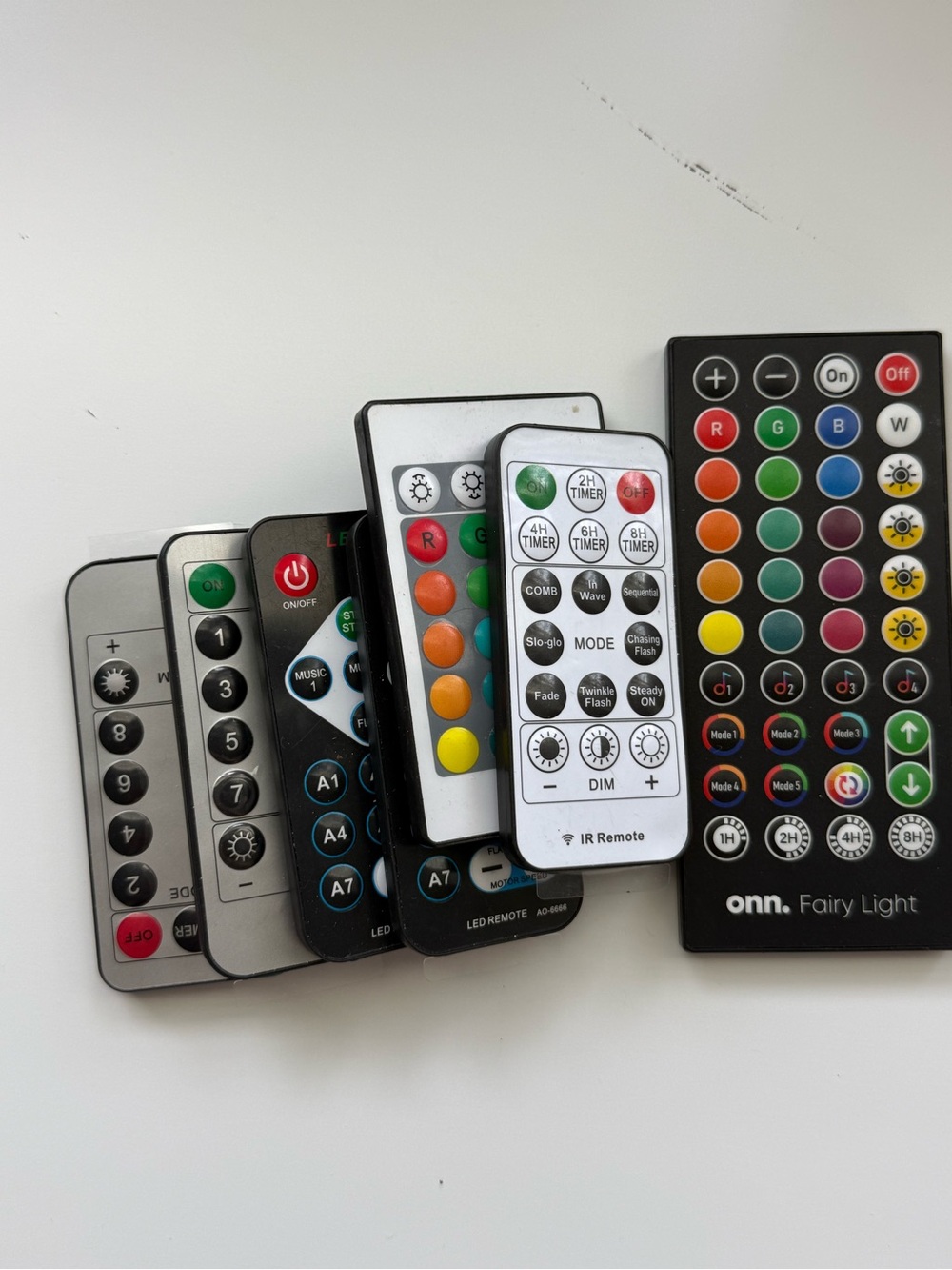 Assorted LED Light Remotes – Black, White, Silver